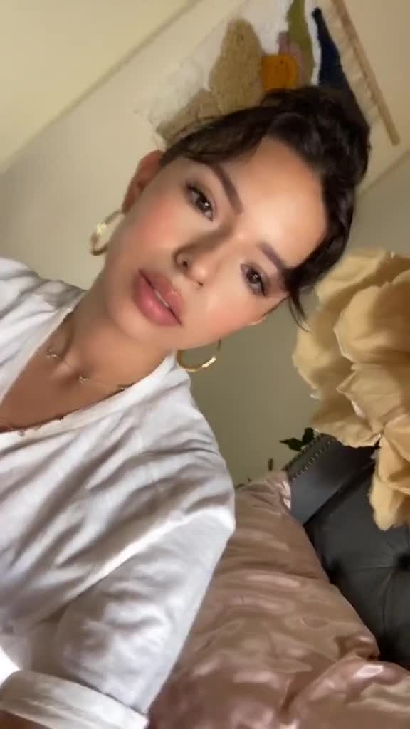 Angela Aguilar on bed…